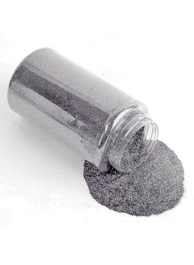 Silver glitter shakers for arts and crafts in a clear bottle with glitter spilling out